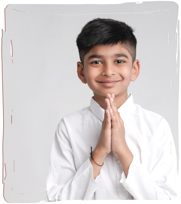 A small boy wearing white dress is making an obeisance.