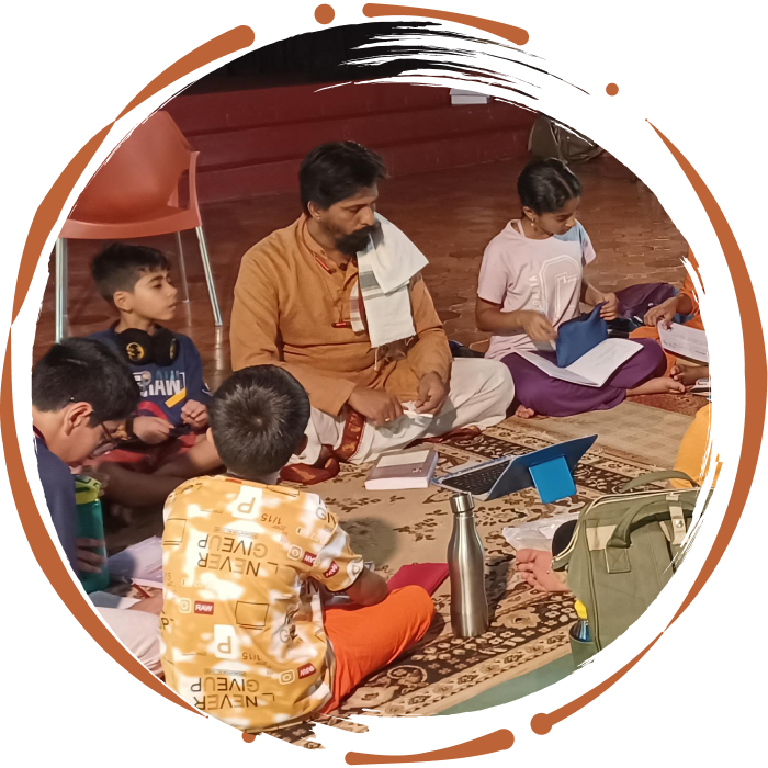 The teacher is taking vedas in offline mode at Gurukulam.